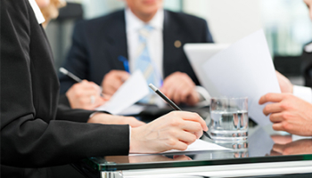 A team of business individuals collaborating at a table