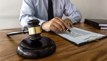 A judge's gavel rests on a desk